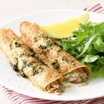 Pfannkuchen mit Lachs in Weinsauce