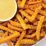 Würzige Pommes frites mit Käsesauce